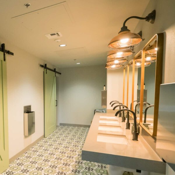The gender-neutral bathroom at The Haven, showing a row of sinks.